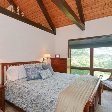 48 Devol Pond Drive Westport, MA 02790 - Photo 19 of 39 a bedroom with a large bed and a large window