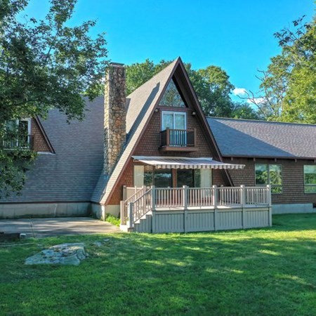48 Devol Pond Drive Westport, MA 02790 - Photo 2 of 39 a front view of a house with a yard