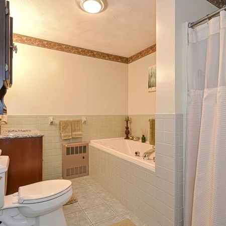 48 Devol Pond Drive Westport, MA 02790 - Photo 22 of 39 a bathroom with a sink a toilet and shower