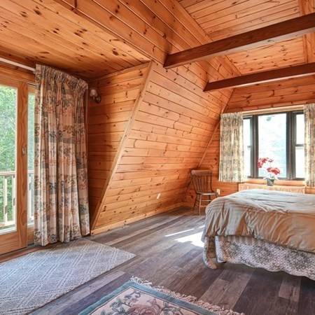 48 Devol Pond Drive Westport, MA 02790 - Photo 25 of 39 a bed sitting in a bedroom next to a window