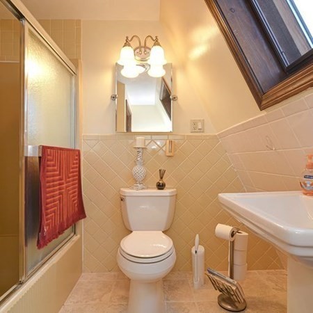 48 Devol Pond Drive Westport, MA 02790 - Photo 30 of 39 a bathroom with a toilet sink and mirror