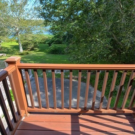 48 Devol Pond Drive Westport, MA 02790 - Photo 32 of 39 a view of balcony with wooden floor and fence