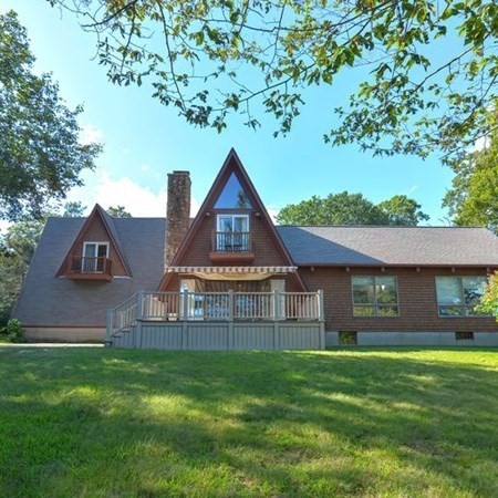 48 Devol Pond Drive Westport, MA 02790 - Photo 34 of 39 a front view of a house with a garden