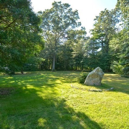 48 Devol Pond Drive Westport, MA 02790 - Photo 36 of 39 a view of a swimming pool with a garden