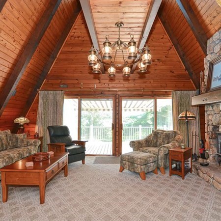 48 Devol Pond Drive Westport, MA 02790 - Photo 6 of 39 a living room with furniture and a floor to ceiling window