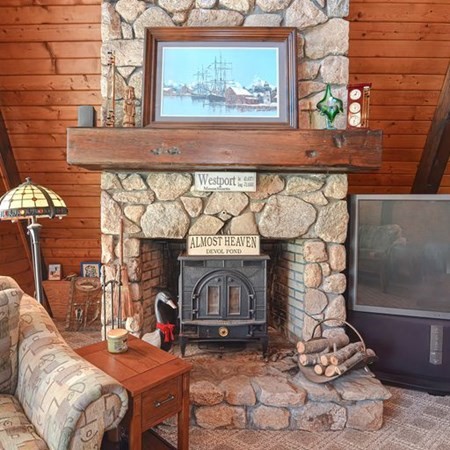 48 Devol Pond Drive Westport, MA 02790 - Photo 8 of 39 a living room with a fireplace