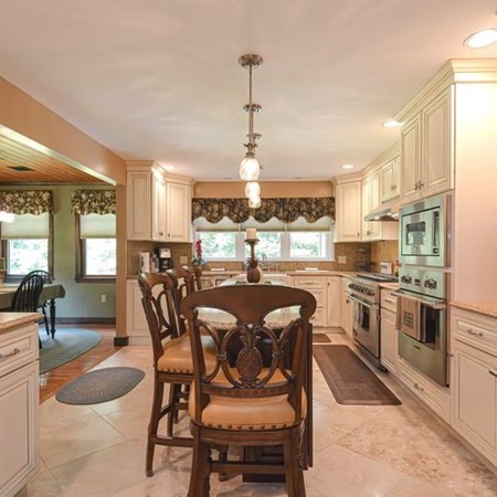 48 Devol Pond Drive Westport, MA 02790 - Photo 10 of 39 a dining table with chairs and kitchen view