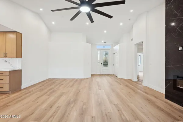 wooden floor in a room with a ceiling fan