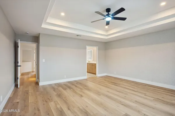 a white bath tub sitting next to a white toilet
