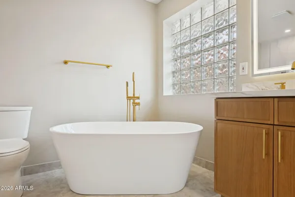 a bathroom with a shower and a toilet