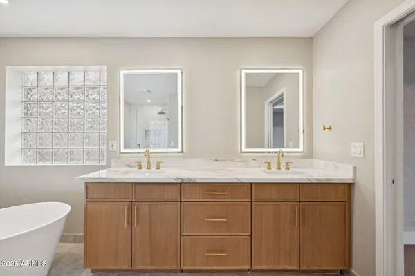 a view of a big room with wooden floor closet and windows