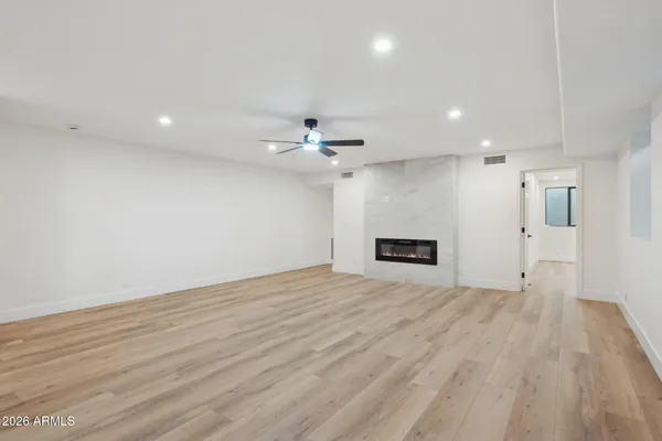 a bathroom with a sink toilet and mirror
