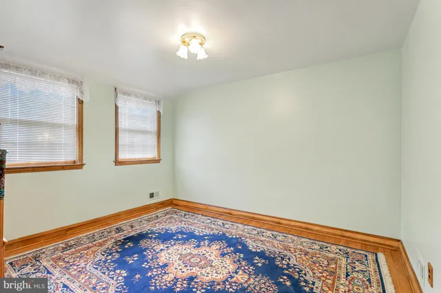 a sign on a wall next to a white wall