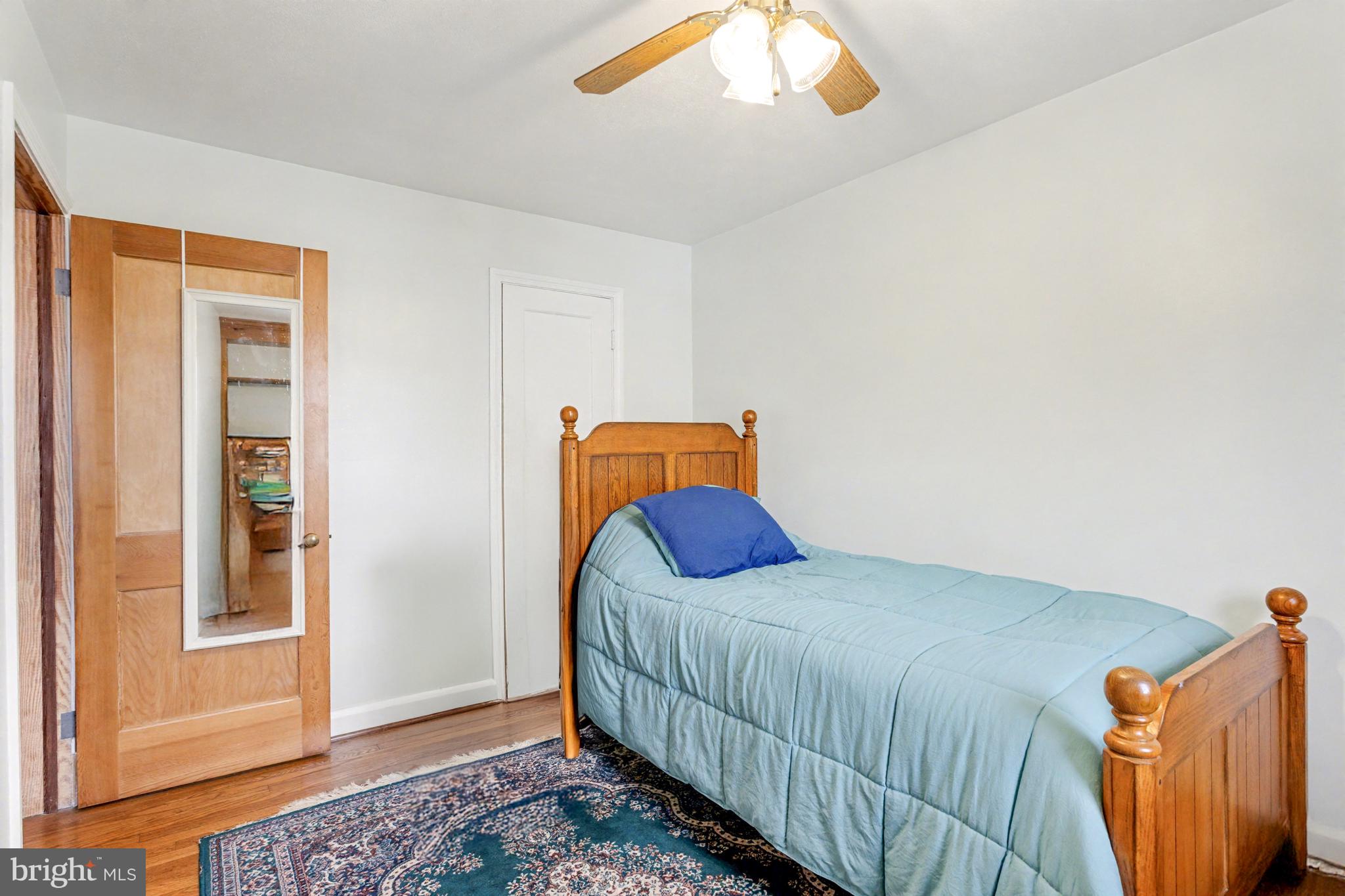 8446 Loch Raven Boulevard Baltimore, MD 21286 - Photo 16 of 30 a bedroom with a bed and a window