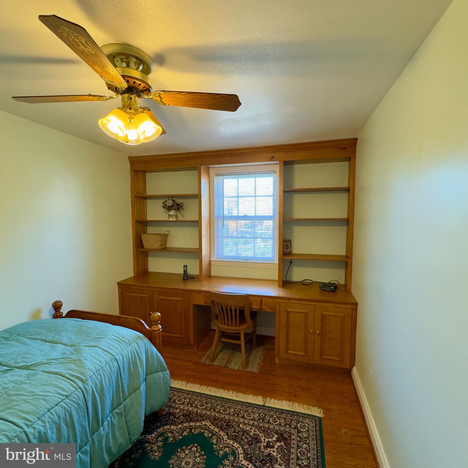 8446 Loch Raven Boulevard Baltimore, MD 21286 - Photo 17 of 30 a bedroom with a bed and a chandelier