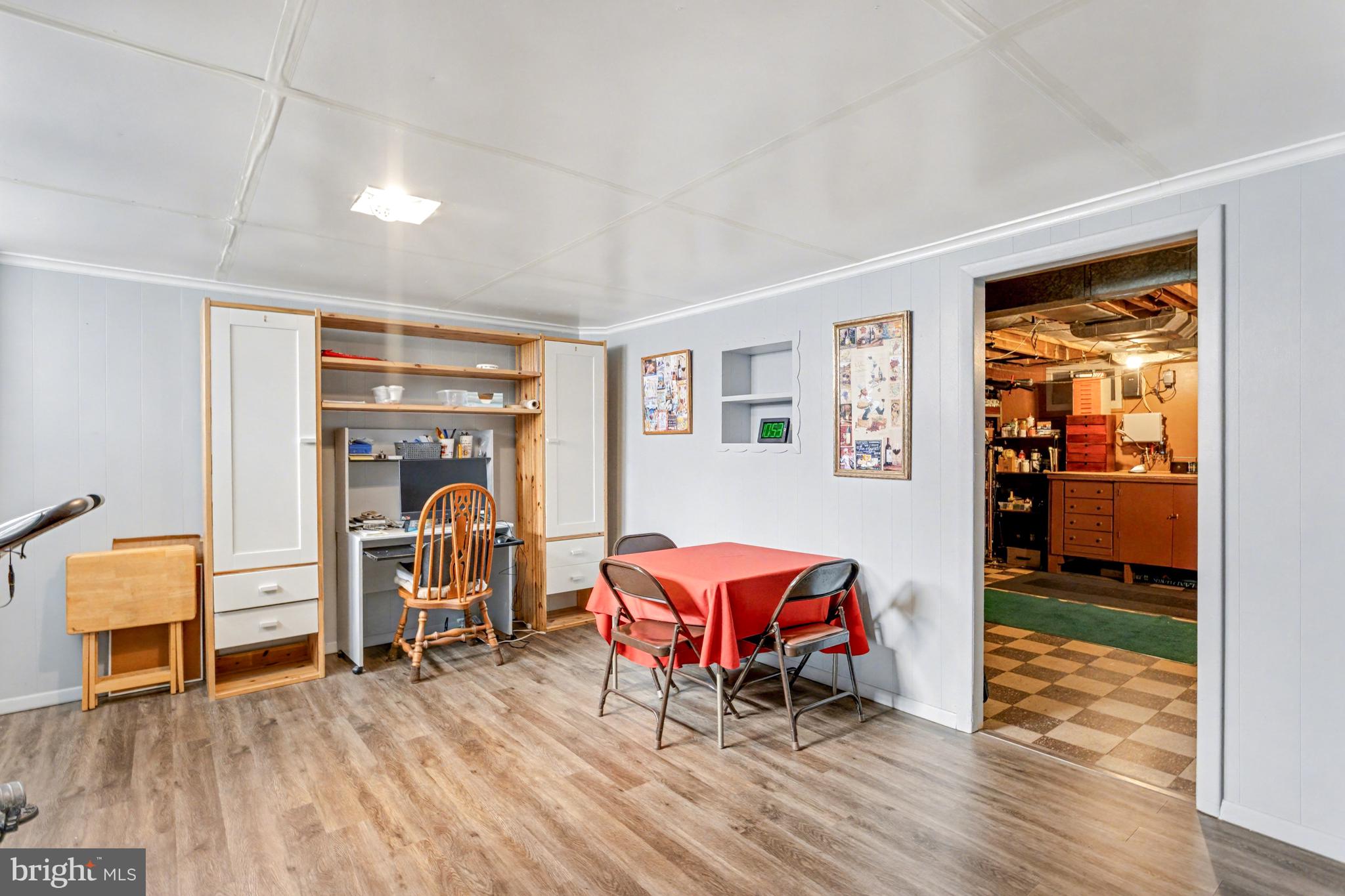 8446 Loch Raven Boulevard Baltimore, MD 21286 - Photo 20 of 30 a room with furniture and a wooden floor