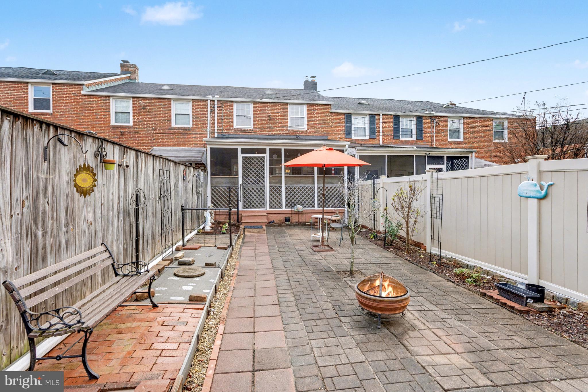 8446 Loch Raven Boulevard Baltimore, MD 21286 - Photo 26 of 30 a view of a patio with table and chairs potted plants with wooden floor
