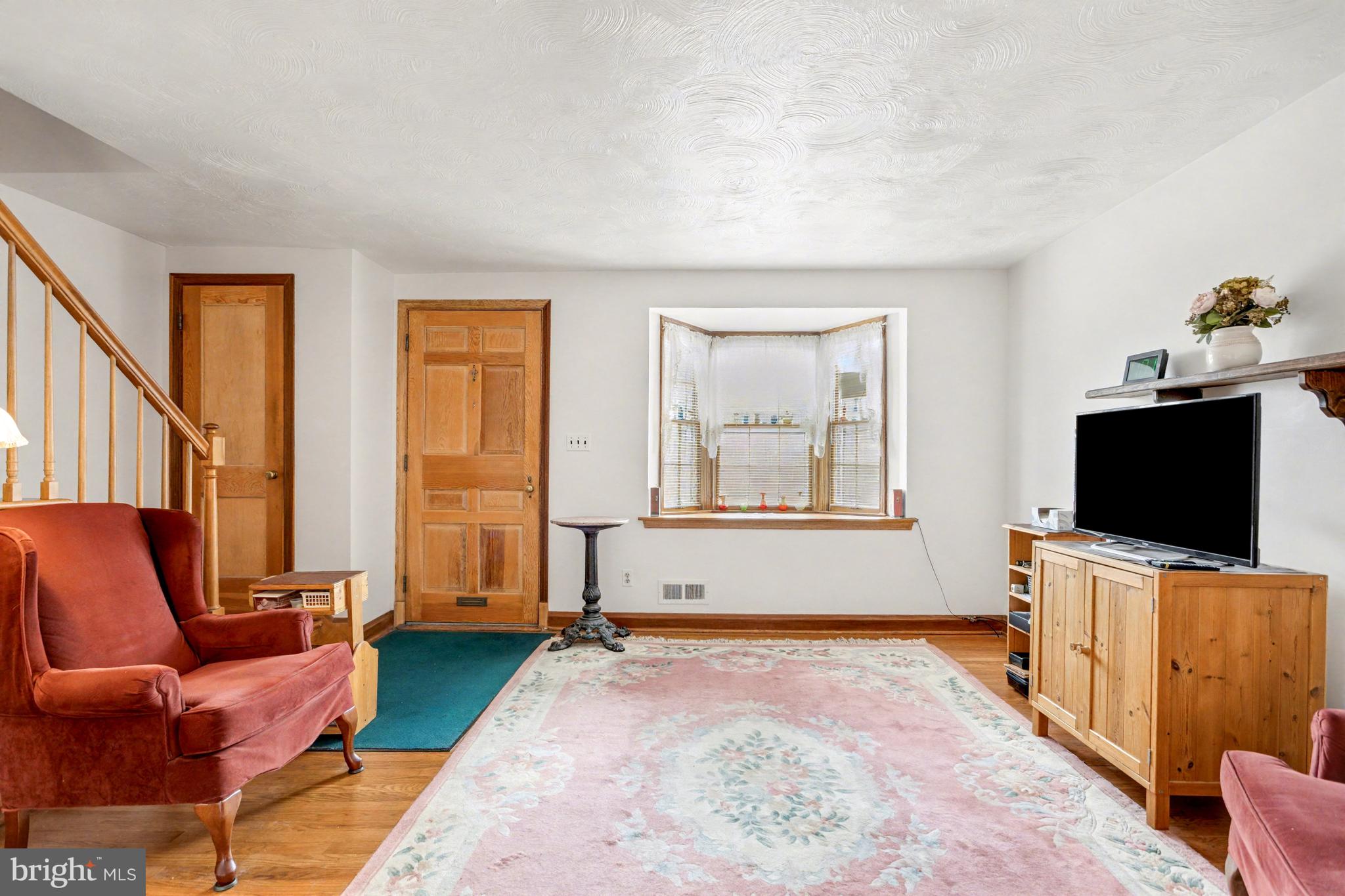 8446 Loch Raven Boulevard Baltimore, MD 21286 - Photo 5 of 30 a living room with furniture and a flat screen tv