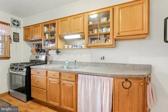 a view of a patio with table and chairs potted plants with wooden floor