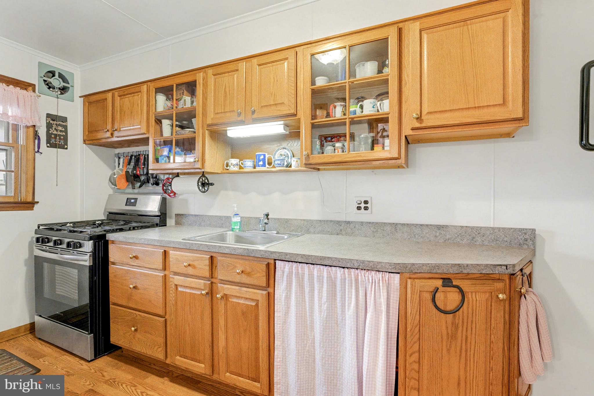 8446 Loch Raven Boulevard Baltimore, MD 21286 - Photo 9 of 30 a kitchen with stainless steel appliances granite countertop a stove and a granite counter tops