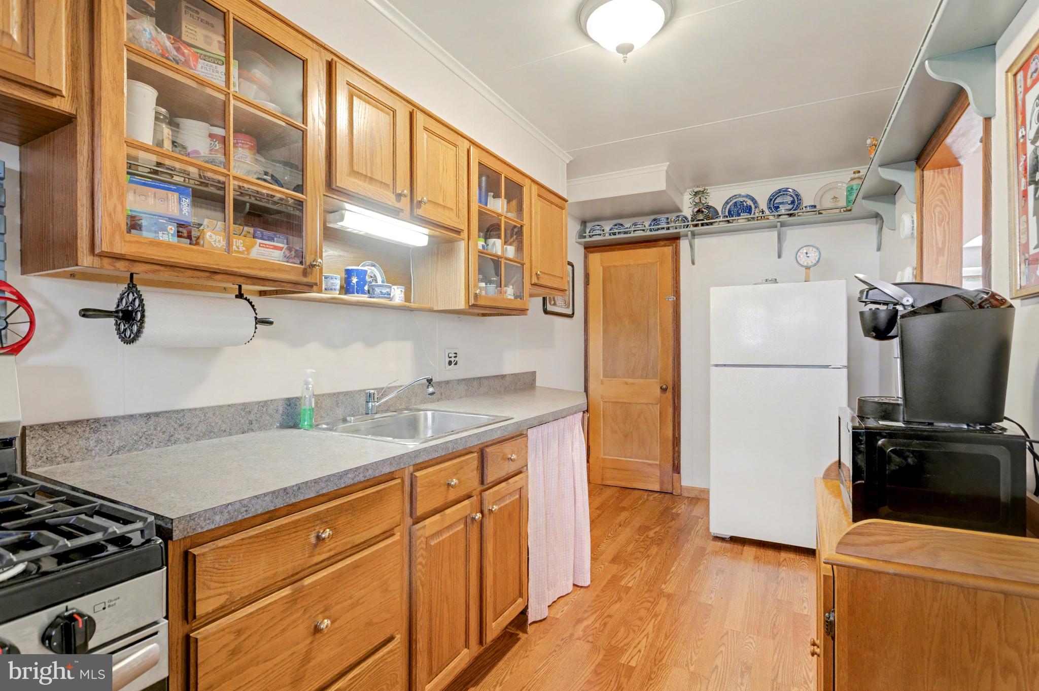 8446 Loch Raven Boulevard Baltimore, MD 21286 - Photo 10 of 30 a kitchen with stainless steel appliances granite countertop a refrigerator and a sink