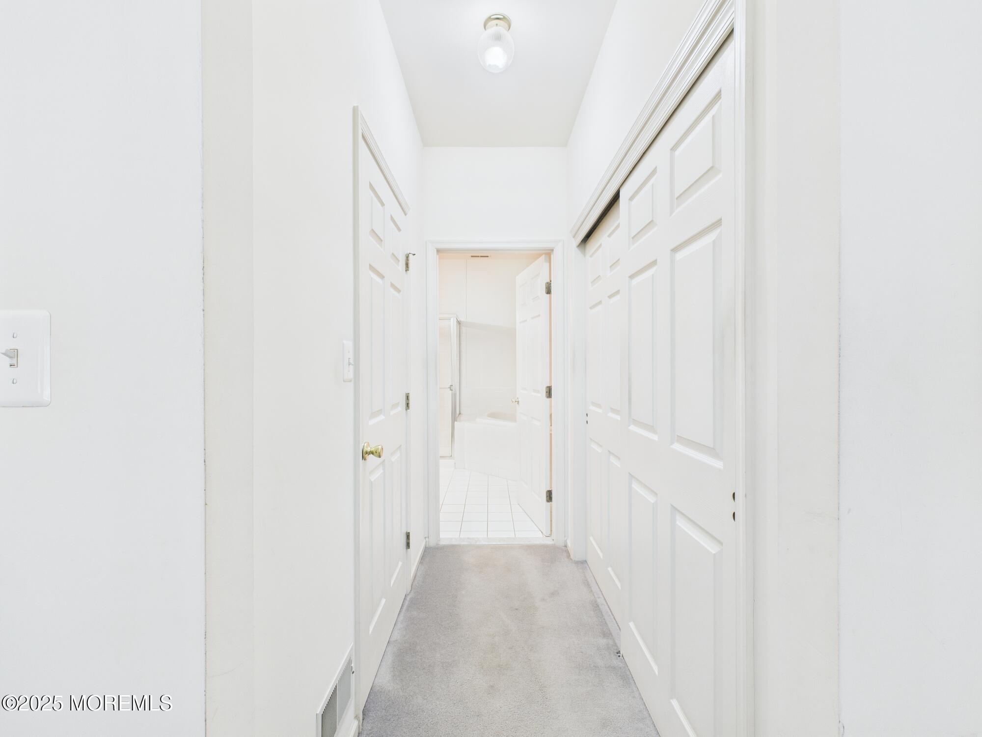 10 Windward Way Red Bank, NJ 07701 - Photo 12 of 31 a view of a hallway with wooden floor and entryway