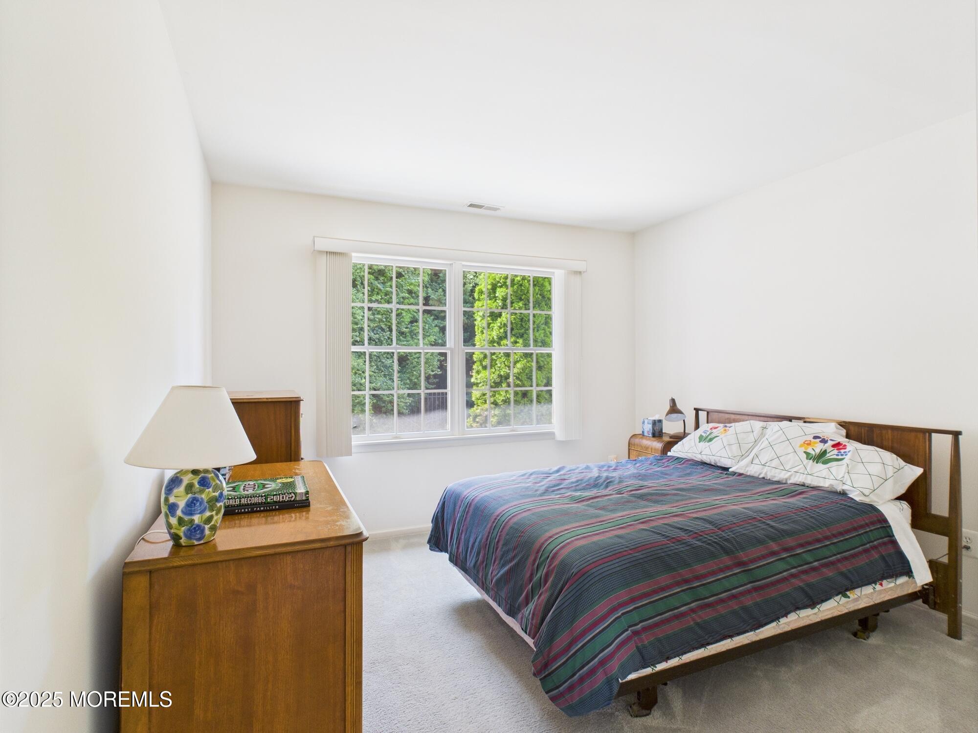 10 Windward Way Red Bank, NJ 07701 - Photo 19 of 31 a bedroom with a bed and a window