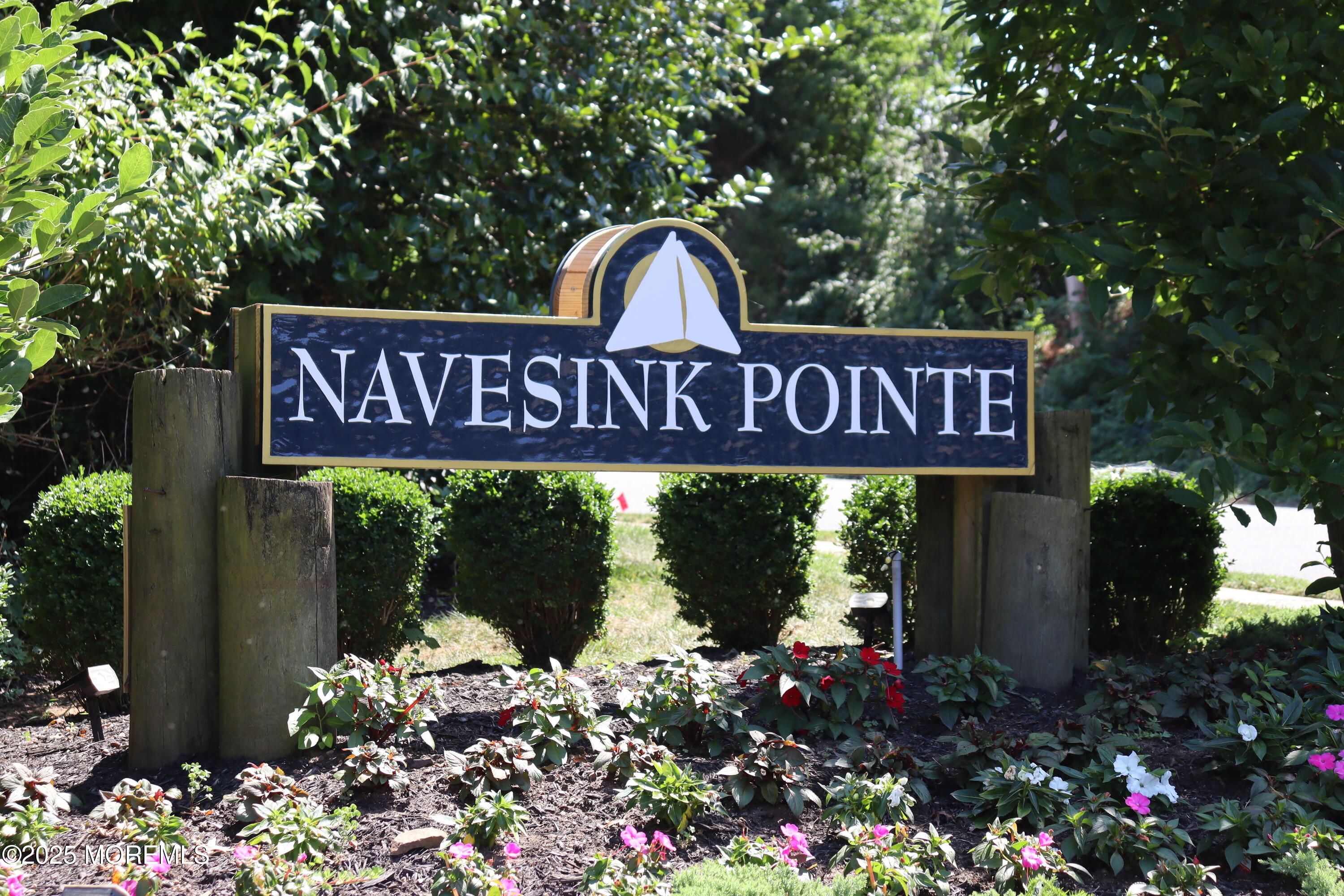 10 Windward Way Red Bank, NJ 07701 - Photo 2 of 31 a sign broad in front of flowers