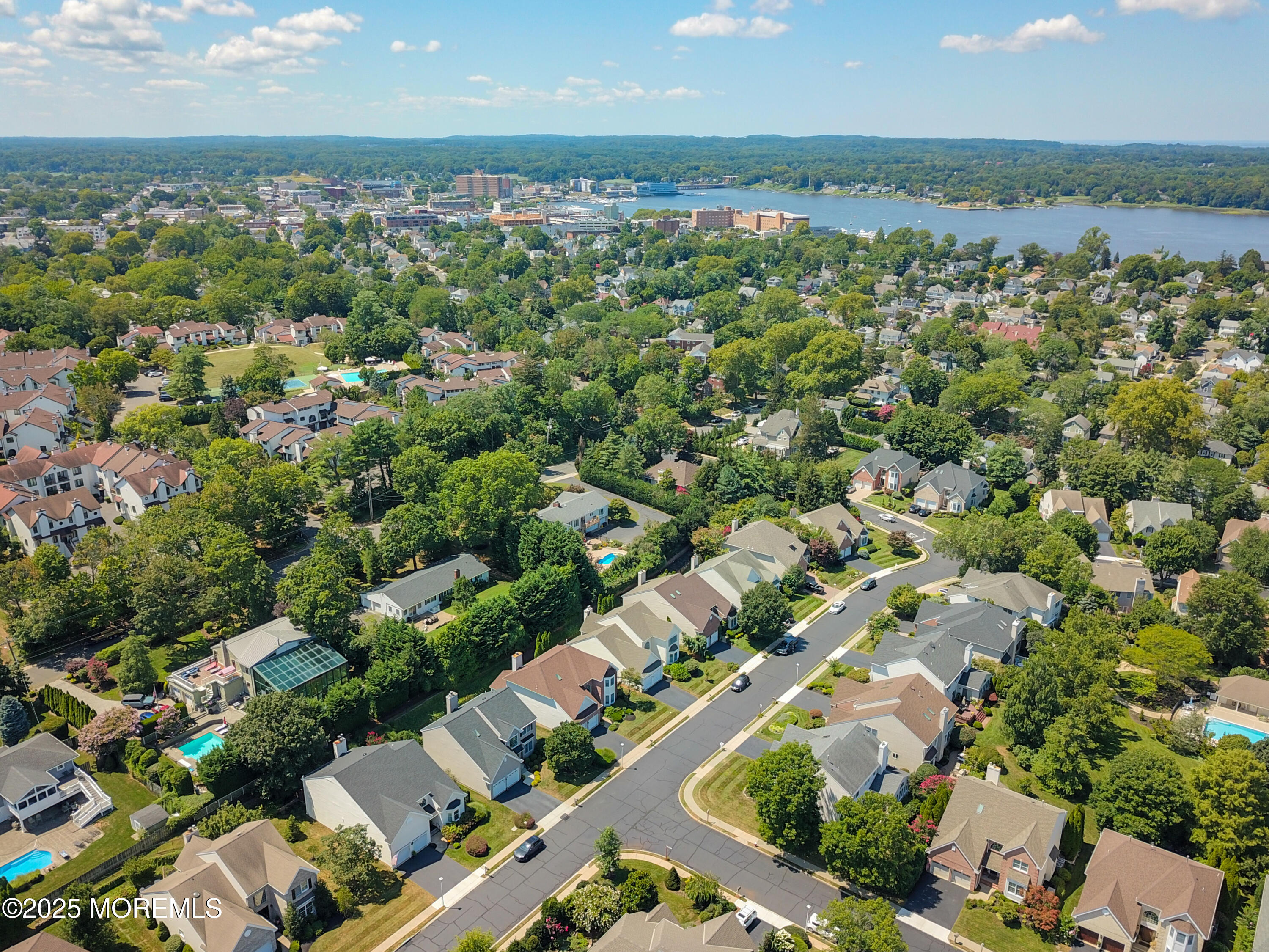 10 Windward Way Red Bank, NJ 07701 - Photo 27 of 31 an aerial view of a city with lots of residential buildings ocean and mountain view in back