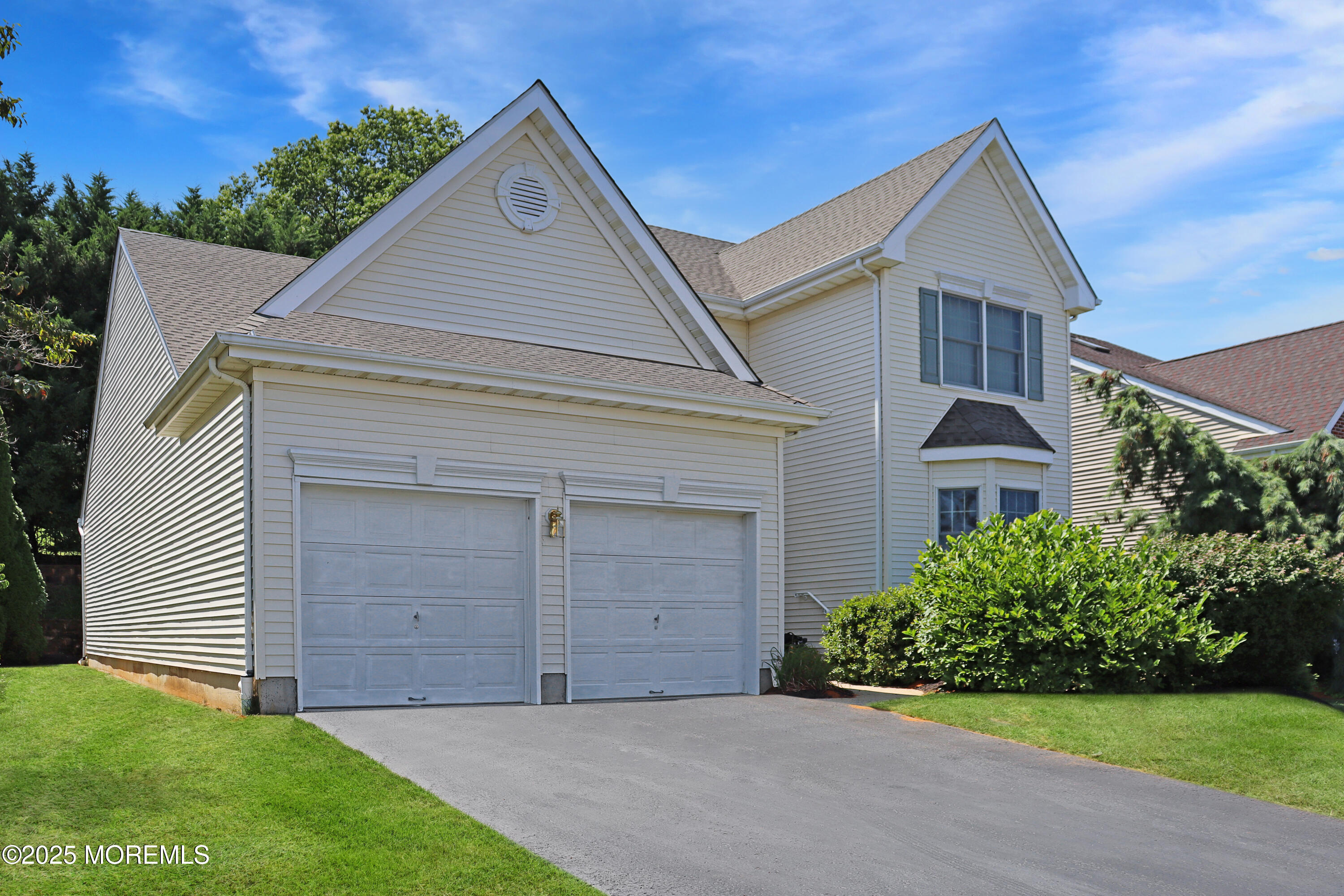 10 Windward Way Red Bank, NJ 07701 - Photo 31 of 31 a front view of a house with a yard and garage