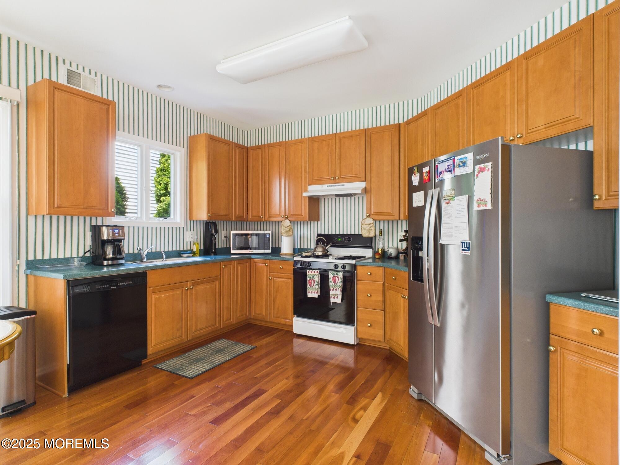 10 Windward Way Red Bank, NJ 07701 - Photo 5 of 31 a kitchen with stainless steel appliances granite countertop a refrigerator and a stove top oven