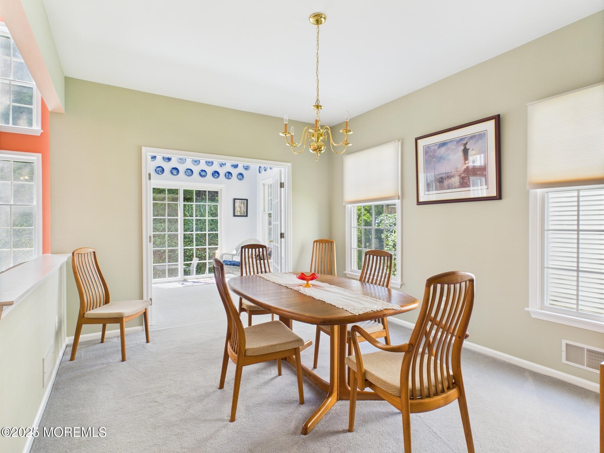 10 Windward Way Red Bank, NJ 07701 - Photo 7 of 31 a view of a dining room with furniture window and outside view