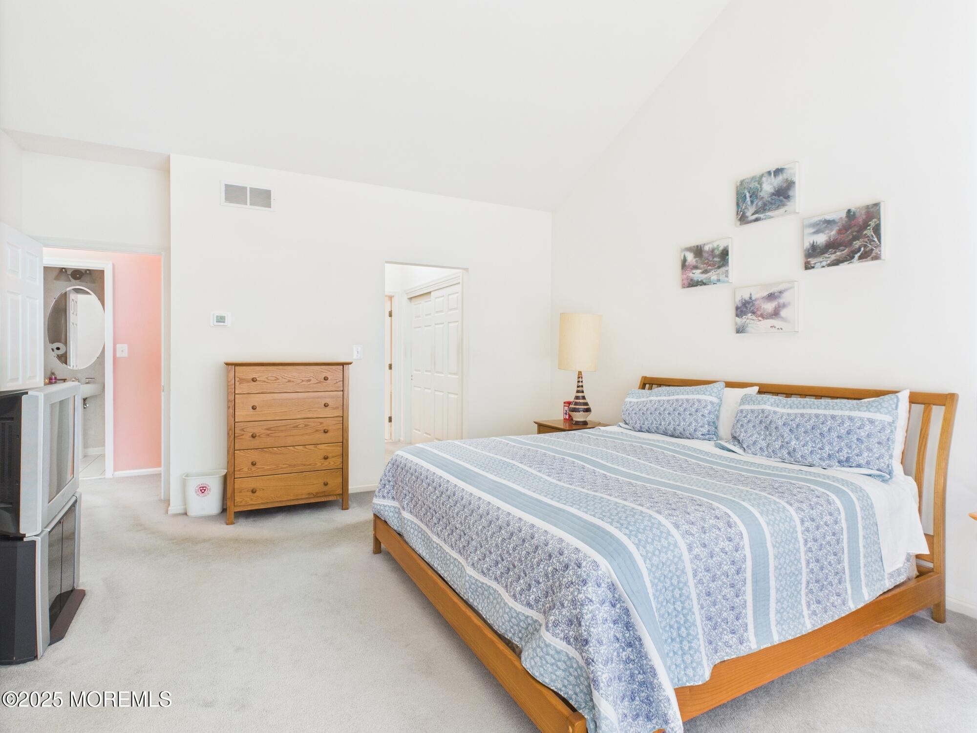 10 Windward Way Red Bank, NJ 07701 - Photo 10 of 31 a bedroom with a bed and a flat screen tv