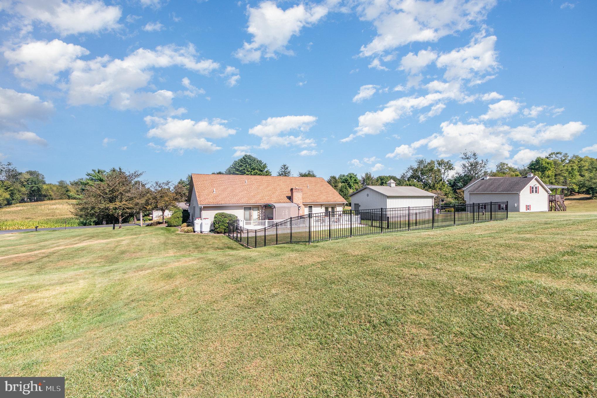 258 Bonnybrook Road Carlisle, PA 17015 - Photo 27 of 31 a view of a big yard with table and chairs