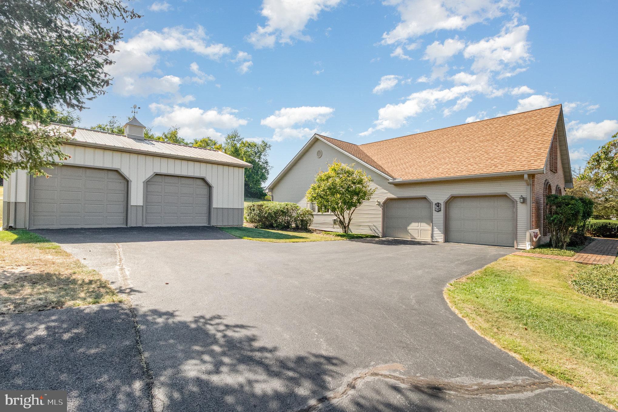 258 Bonnybrook Road Carlisle, PA 17015 - Photo 30 of 31 a view of a house with a yard and garage