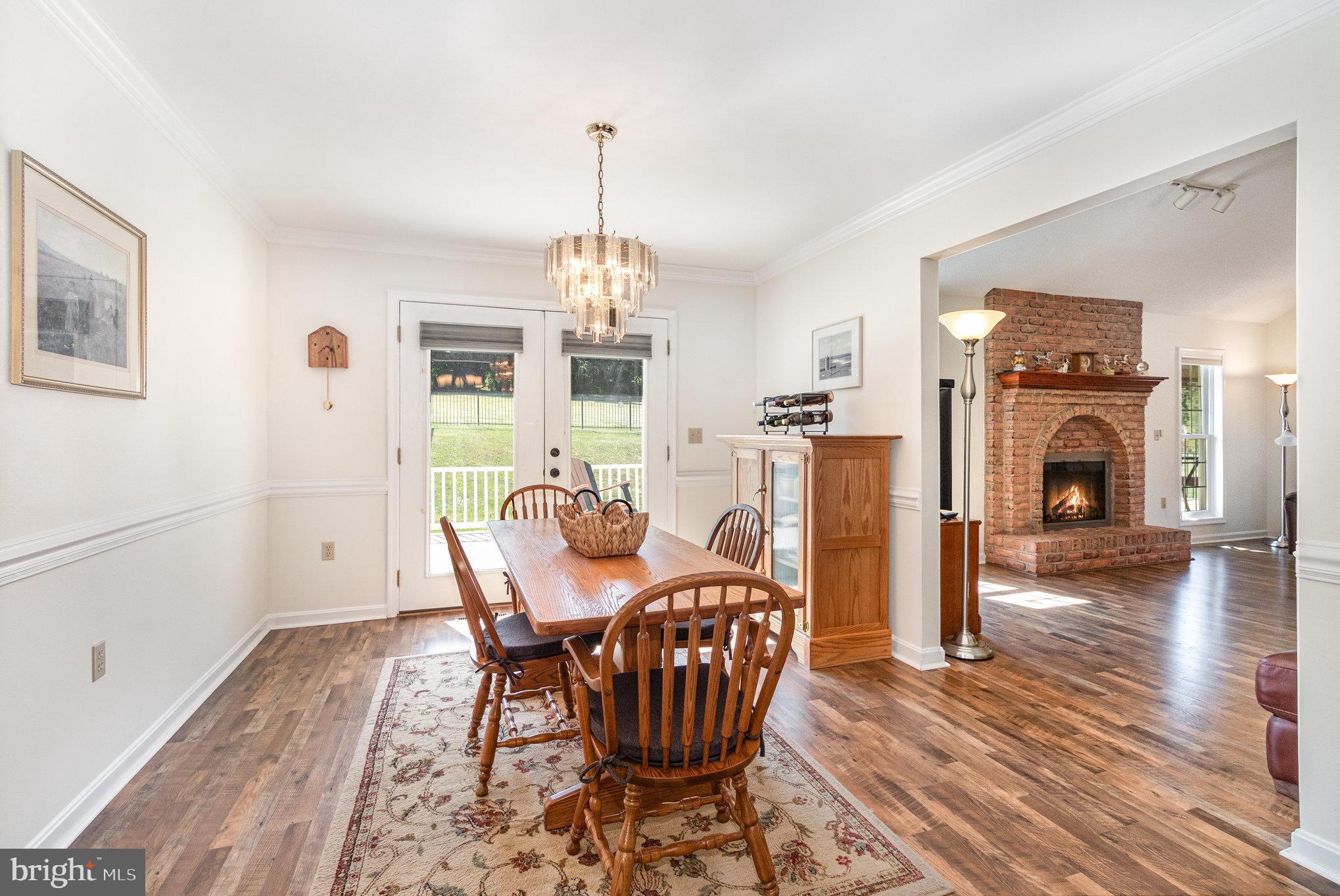 258 Bonnybrook Road Carlisle, PA 17015 - Photo 5 of 31 a view of a dining room with furniture wooden floor kitchen and a chandelier