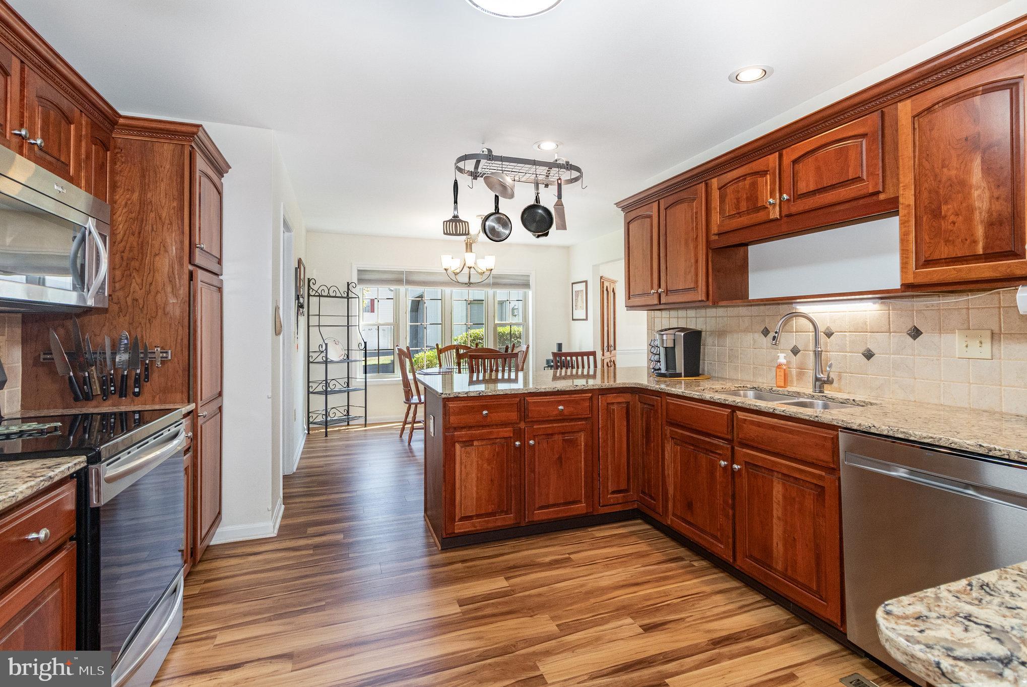258 Bonnybrook Road Carlisle, PA 17015 - Photo 9 of 31 a kitchen with stainless steel appliances granite countertop wooden cabinets a stove and a sink