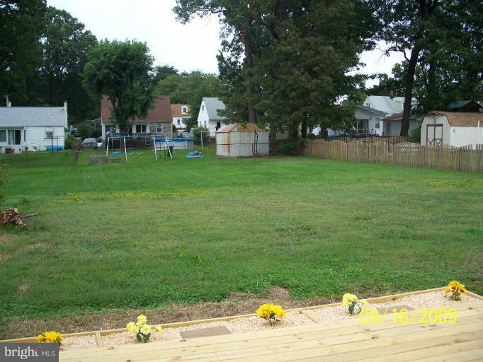 332 Savannah Road Essex, MD 21221 - Photo 4 of 13 a backyard of a house with lots of green space