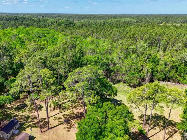 a view of a field with an outdoor space