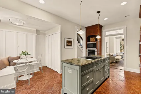 a kitchen that has a lot of cabinets in it