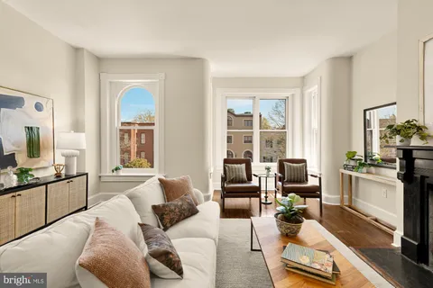 a living room with furniture or couch and a stove