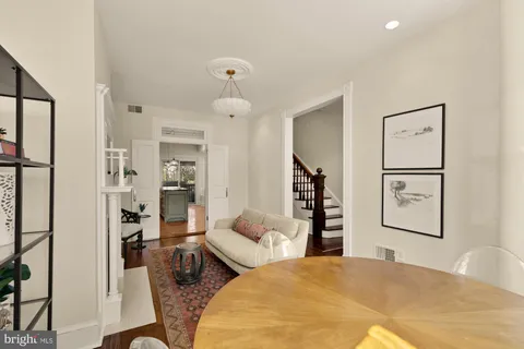 a bedroom with furniture and wooden floor