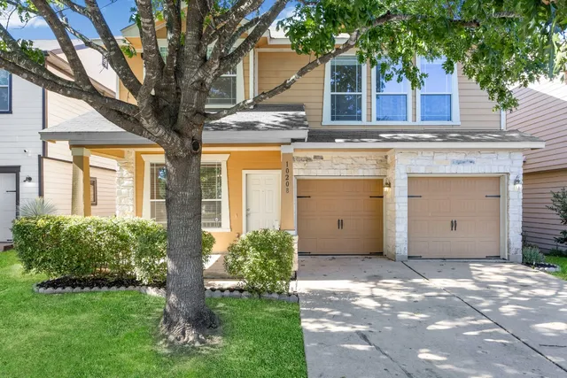 a view of a house with a garden