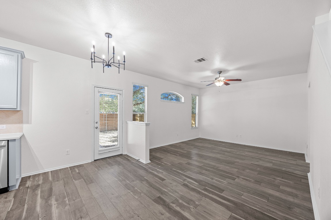 10208 Laredo Drive, Unit 105 Austin, TX 78748 - Photo 17 of 37 wooden floor in an empty room with a window
