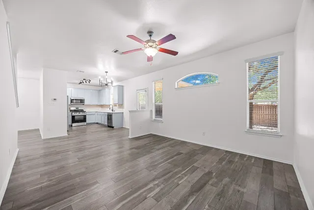 a view of kitchen with wooden floor and window