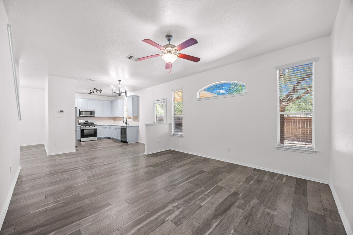 10208 Laredo Drive, Unit 105 Austin, TX 78748 - Photo 19 of 37 a view of kitchen with wooden floor and window