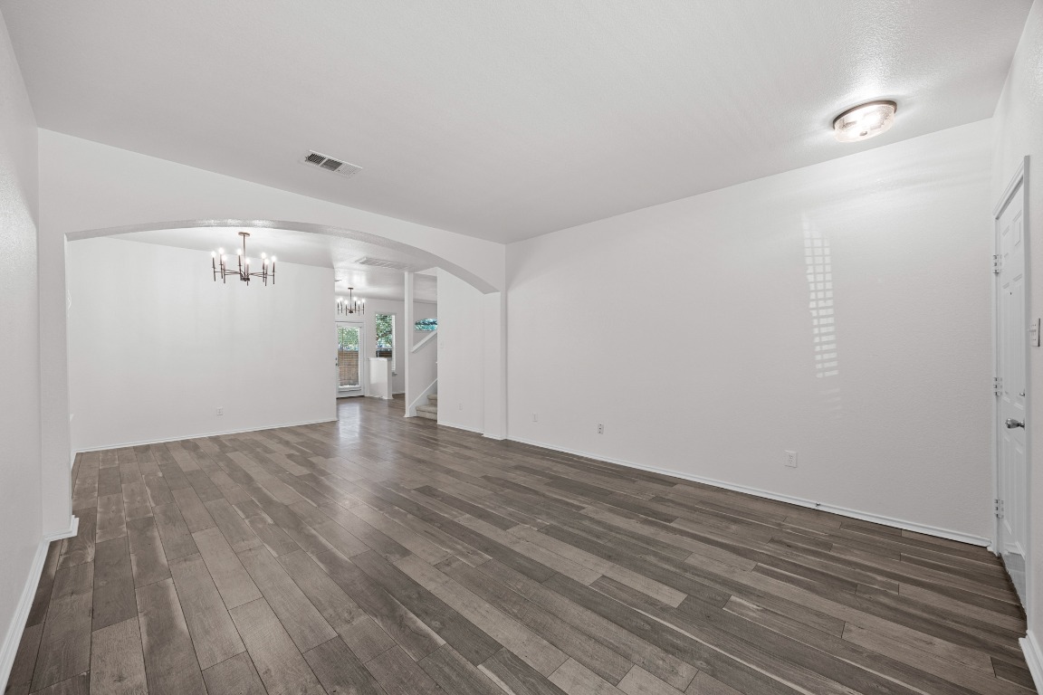 10208 Laredo Drive, Unit 105 Austin, TX 78748 - Photo 4 of 37 a view of a livingroom with wooden floor