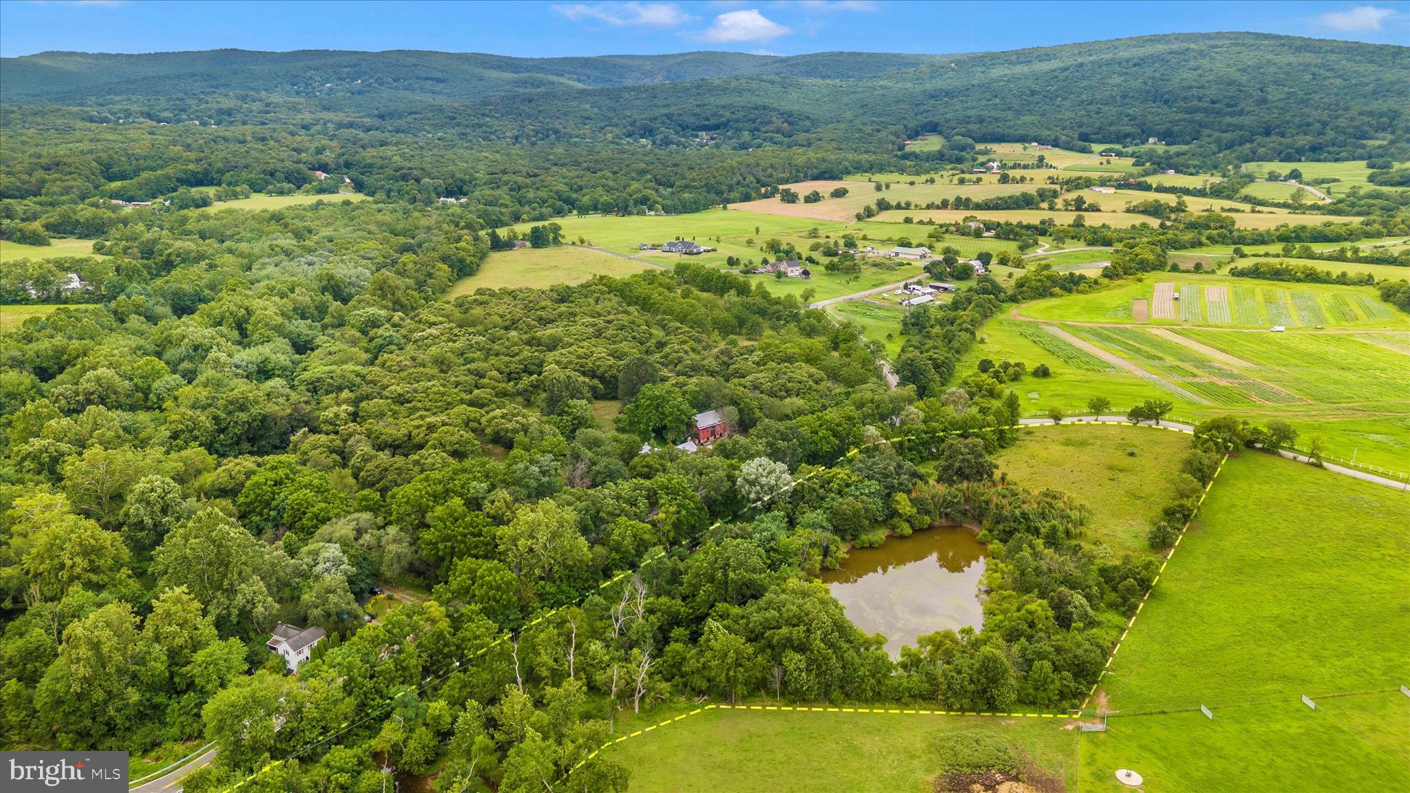 Opossumtown Pike Frederick, MD 21702 - Photo 3 of 12 a view of a lake with a mountain