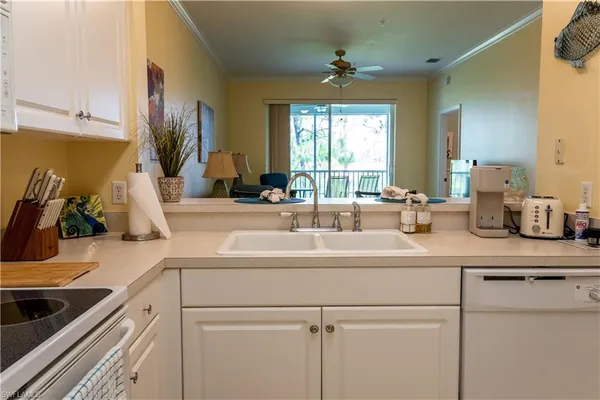 a bedroom with two beds and a window