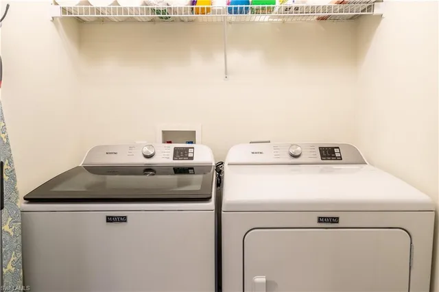 a bathroom with a toilet sink and shower curtain